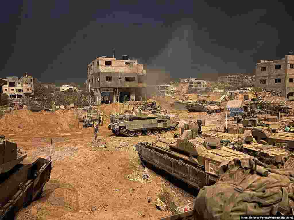 Armored vehicles of the Israel Defense Forces (IDF) are seen during their ground operations at a location given as Gaza, as the conflict between Israel and the Palestinian Islamist group Hamas continues.