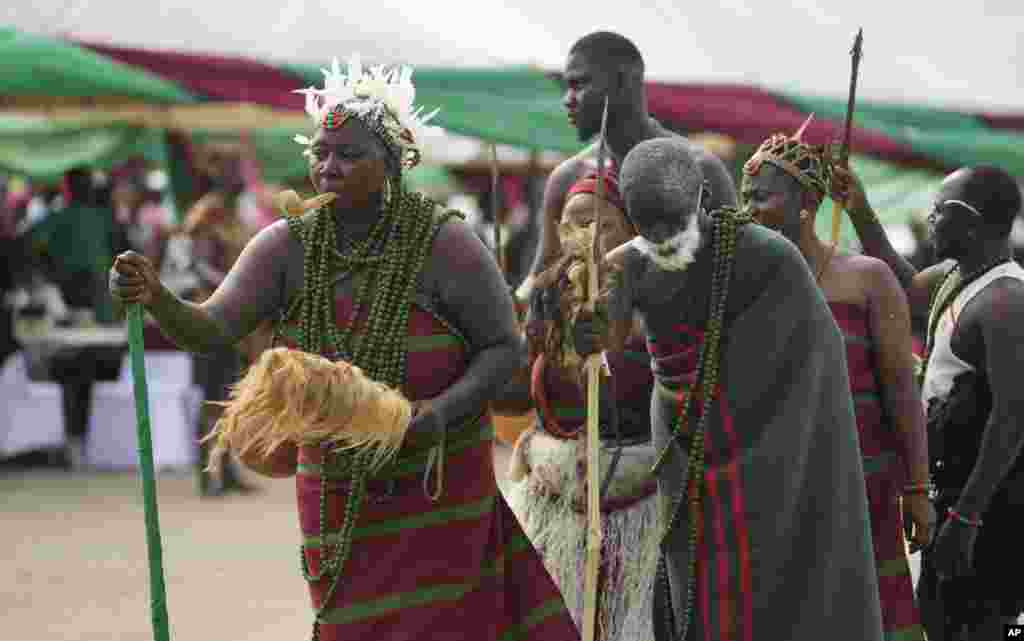 People dressed in traditional clothes perform, during the annual celebration of the Berom tribes, in Lagos Nigeria, Dec. 3, 2023.