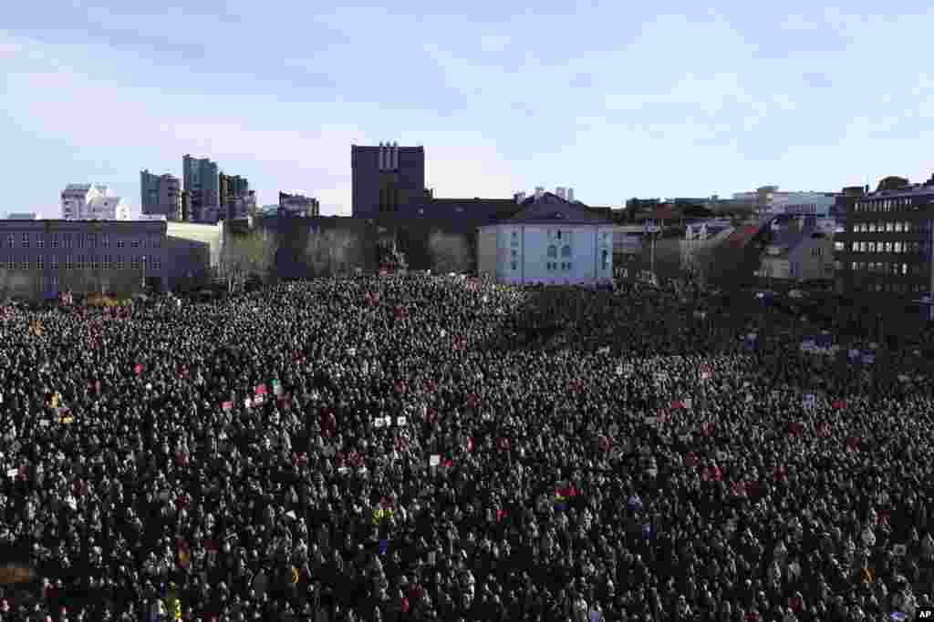 People across Iceland gather during the women's strike in Reykjavik. Iceland's prime minister and women across the island nation are on strike to push for an end to unequal pay and gender-based violence.