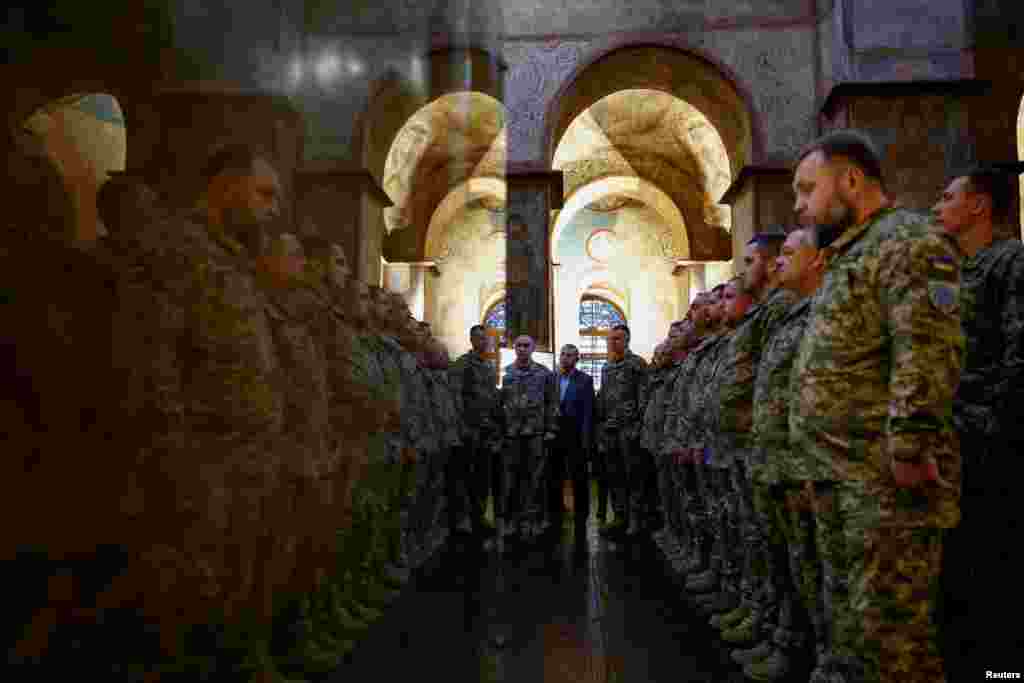 Ukrainian Army chaplains attend a graduation ceremony, amid Russia's attack on Ukraine, inside the Saint Sophia Cathedral in Kyiv, Ukraine.