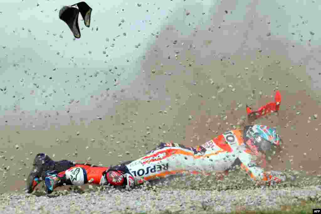 Honda Spanish rider Marc Marquez crashes during the first MotoGP free practice session of the Moto Grand Prix of Catalonia at the Circuit de Catalunya in Montmelo on the outskirts of Barcelona.