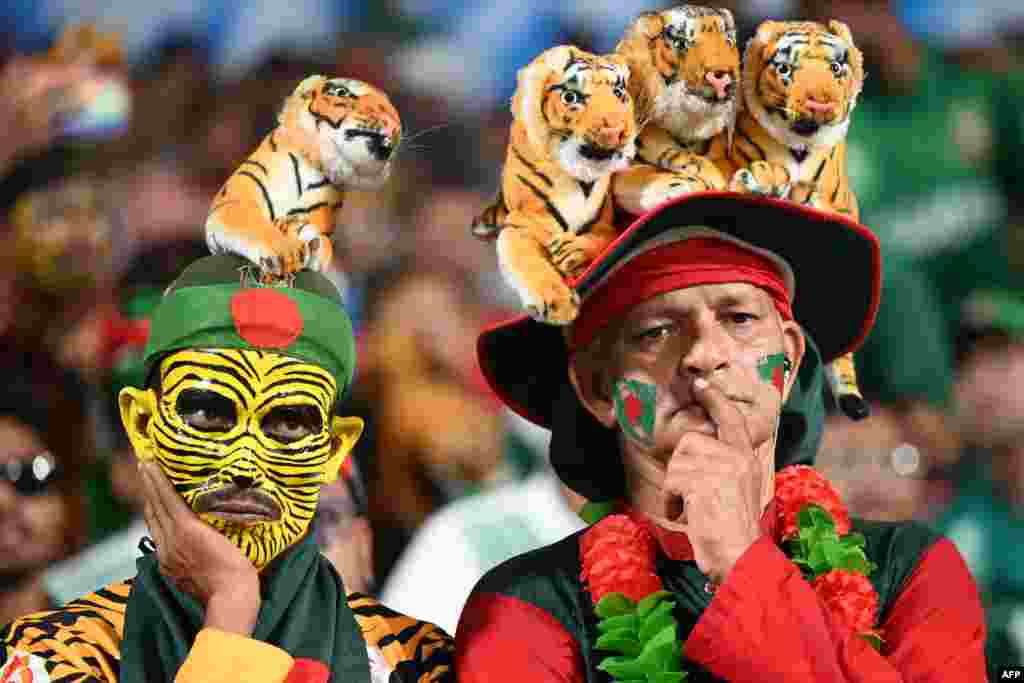 Bangladesh fans react while watching the 2023 ICC Men's Cricket World Cup one-day international (ODI) match between Pakistan and Bangladesh at the Eden Gardens in Kolkata, India.