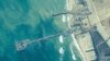 FILE - This image provided by U.S. Central Command shows the U.S.-built temporary pier on the coast of the Gaza Strip, on May 16, 2024.