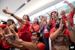 Pheu Thai supporters react during a parliamentary vote on Srettha Thavisin's prime ministerial candidacy, at the party headquarters in Bangkok, Thailand, Tuesday, Aug. 22, 2023. (AP Photo/Wason Wanichakorn)