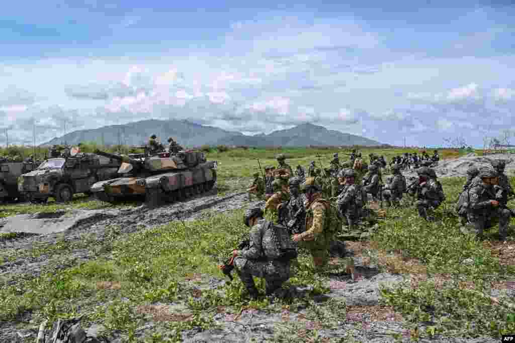 Australian and Filipino troops held exercises near flashpoint South China Sea waters claimed by China, with Philippine President Ferdinand Marcos hailing them as an "extremely important" example of close cooperation. 