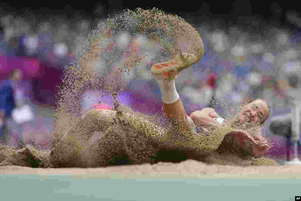Uzbekistan's Ekaterina Voronina competes during the women's heptathlon long jump at the 19th Asian Games in Hangzhou, China.