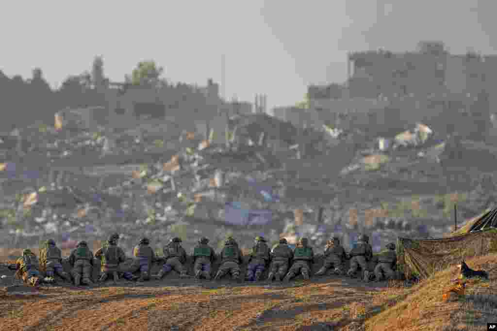 Israeli soldiers take positions near the Gaza Strip border in southern Israel.