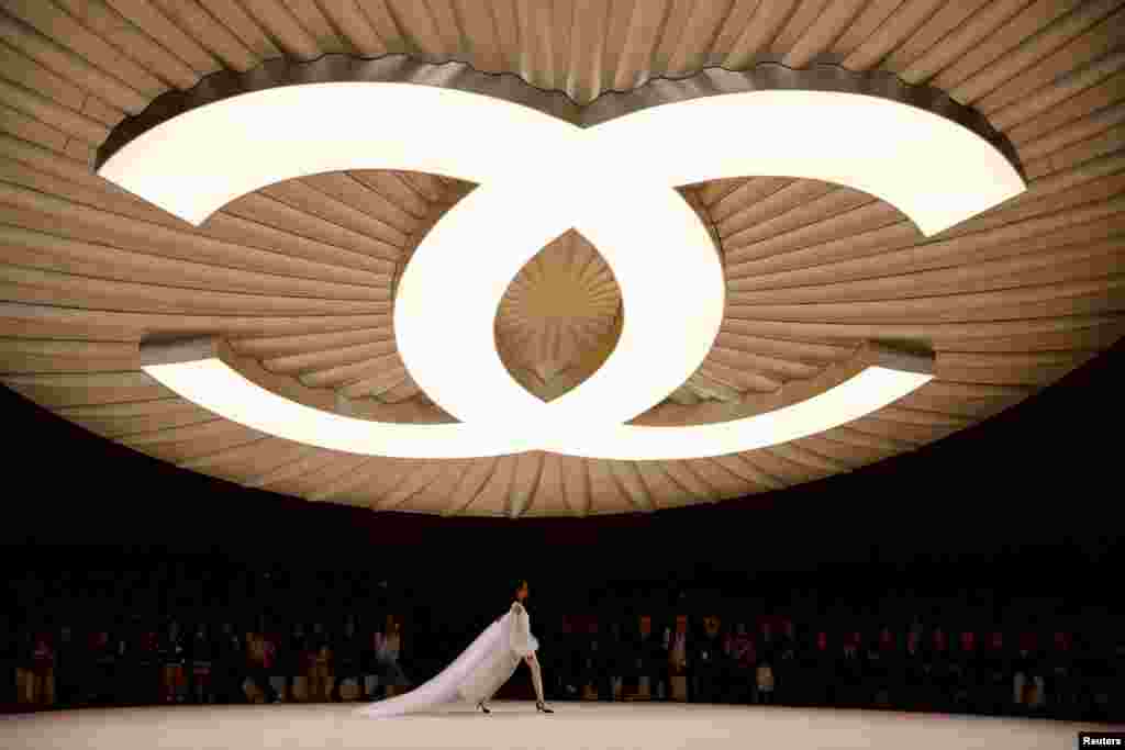 A model presents a creation by designer Virginie Viard as part of her Haute Couture Spring-Summer 2024 collection show for fashion house Chanel in Paris, France.
