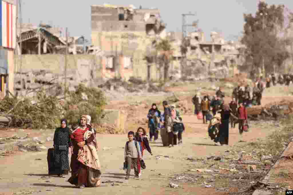 Palestinians fleeing the north walk along the Salaheddine road in the Zeitoun district on the southern outskirts of Gaza City. Israel faces mounting pressure to extend a four-day pause in its war against Hamas, but military officials fear that a longer truce risks blunting its efforts to rout the Islamist movement.