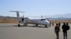 FILE - Passengers board the Ethiopian Airlines plane at the Lalibela Airport in Lalibela town of the Amhara Region, Ethiopia, Jan. 27, 2022.