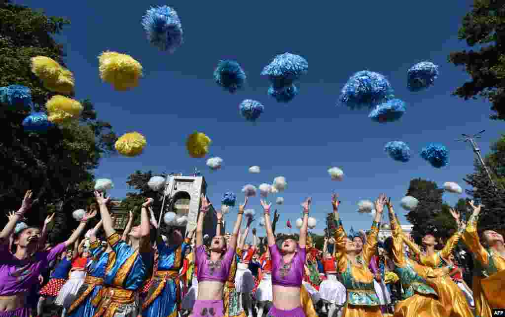 Children attend the celebrations marking the International Children's Day in central Bishkek, Kazakhstan.