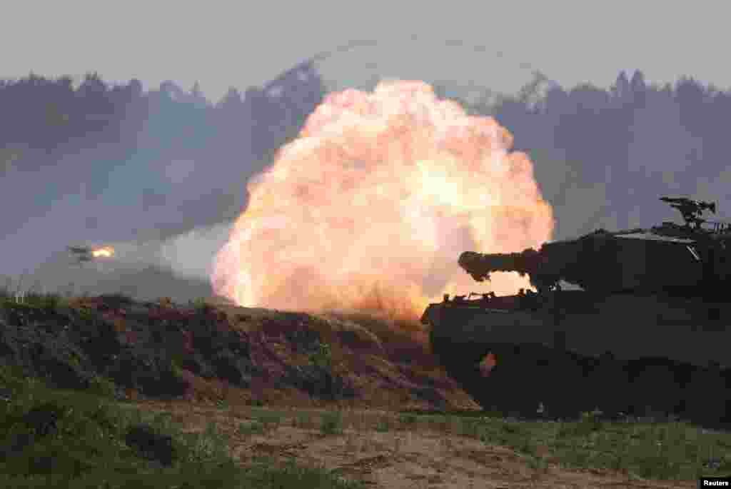 A Polish Leopard 2PL tank fires during Defender Europe 2022 military exercise of NATO troops including French, American, and Polish troops at the military range in Bemowo Piskie, near Orzysz, Poland amid the Russian invasion of Ukraine.