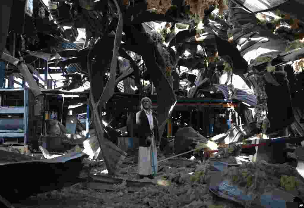 An elderly man stands among the rubble of the Alsonidar Group's water pump and pipe factory after it was hit by Saudi-led airstrikes in Sana'a, Yemen.