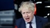 FILE - Britain's Foreign Secretary Boris Johnson talks to reporters as he arrives at a European Union foreign ministers meeting in Brussels, Belgium, March 19, 2018. 