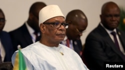 FILE - Mali's President Ibrahim Boubacar Keita attends the summit of the Heads of state from the eight-nation West African Economic and Monetary Union (UEMOA) in Abidjan, Ivory Coast, July 12, 2019.