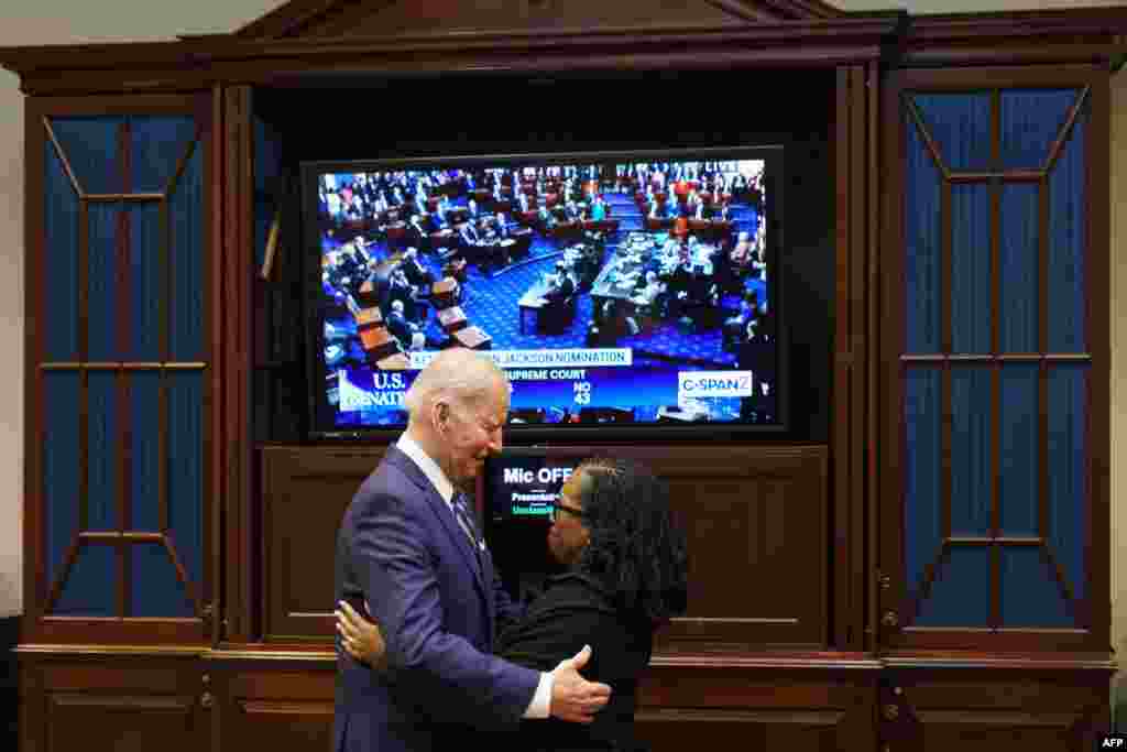 U.S. President Joe Biden embraces Judge Ketanji Brown Jackson as they watch the Senate vote on her nomination to be an associate justice on the U.S. Supreme Court, from the Roosevelt Room of the White House in Washington.