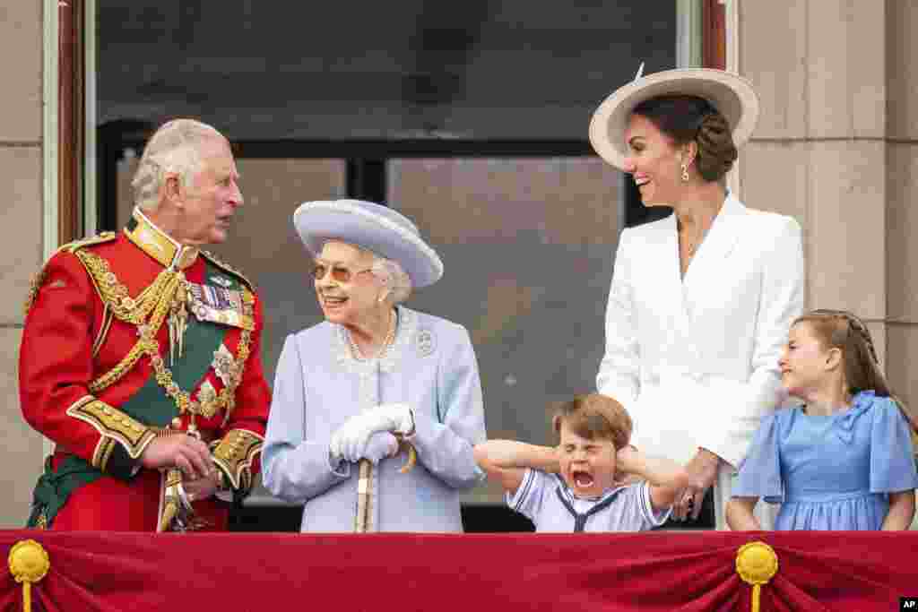 Britain's Prince Charles, Queen Elizabeth II, Prince Louis, Kate, Duchess of Cambridge and Princess Charlotte stands on the balcony of Buckingham Palace after the Trooping the Color ceremony in London on the first of four days of celebrations to mark the Platinum Jubilee.