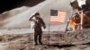 FILE - In this July 30, 1971 NASA photo, Apollo 15 Lunar Module Pilot James B. Irwin salutes while standing beside the fourth American flag planted on the moon. On March 26, 2019, Vice President Mike Pence called for landing astronauts on the moon within five years.