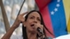 La candidata presidencial opositora, María Corina Machado, ofrece un discurso a sus seguidores durante una actividad para conmemorar los 66 años del derrocamiento del dictador Marcos Pérez Jiménez. 