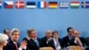 U.S. Secretary of State John Kerry (L) attends a NATO foreign ministers meeting in Brussels December 3, 2013.