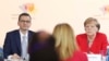 German Chancellor Angela Merkel and Poland's Prime Minister Mateusz Morawiecki listen to a speech by Poland's President Andrzej Duda during a summit on Western Balkan states' EU aspirations, in Poznan, Poland, July 5, 2019.