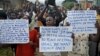 FILE - Protesters march who are against Burundi President Pierre Nkurunziza and his bid for a third term, in Bujumbura, Burundi, June 4, 2015.