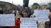 FILE - Protesters march who are against Burundi President Pierre Nkurunziza and his bid for a third term, in Bujumbura, Burundi, June 4, 2015.