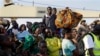 In this image taken Saturday May 23, 2015, refugees who fled Burundi's violence and political tension arrive in Kigoma, Tanzania, rafter making the journey on Lake Tanganyika. aT LEAST 144,000 have fled Burundi because they are afraid of getting caught in