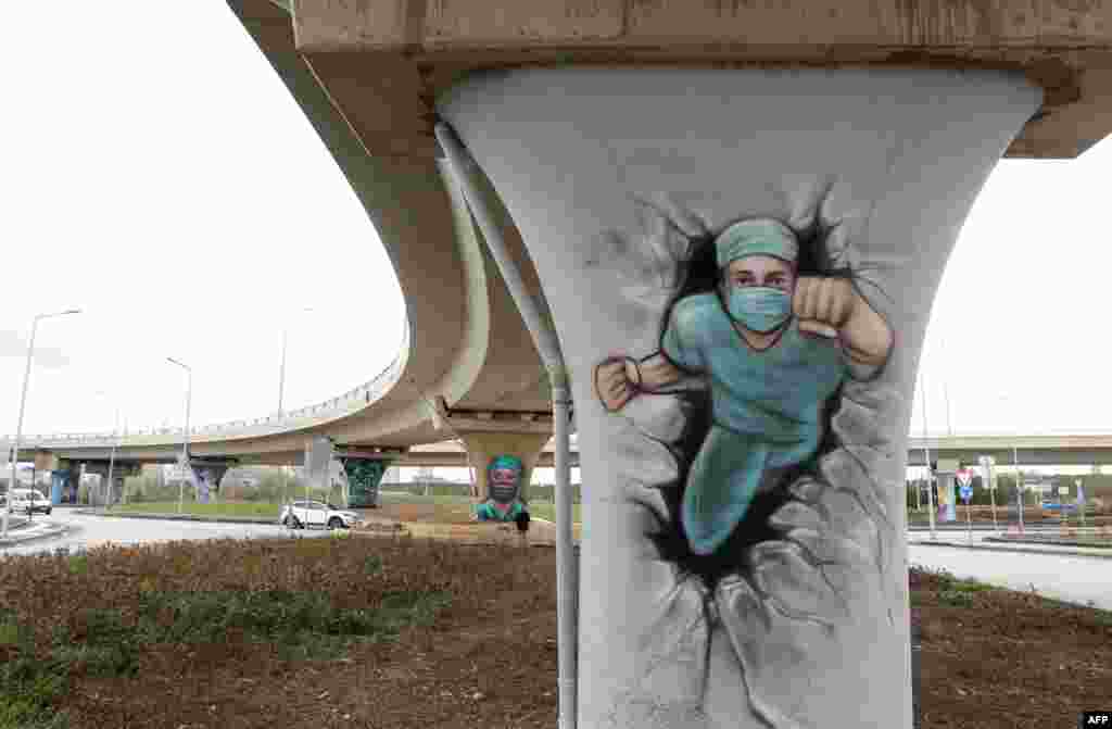 Ankara's Metropolitan Municipality uses graffiti to dedicate healthcare workers during the Covid-19 pandemic in the City Hospital region of Ankara, Turkey.