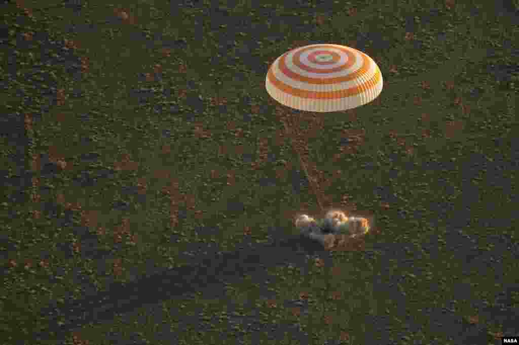 The Soyuz TMA-20M spacecraft lands with Expedition 48 crew members NASA astronaut Jeff Williams, Russian cosmonauts Alexey Ovchinin, and Oleg Skripochka of Roscosmos near the town of Zhezkazgan, Kazakhstan.