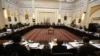 FILE - Delegations from Afghanistan, Pakistan, the United States and China discuss a road map for ending the war with the Taliban at the Presidential Palace in Kabul, Afghanistan, Feb. 23, 2016.