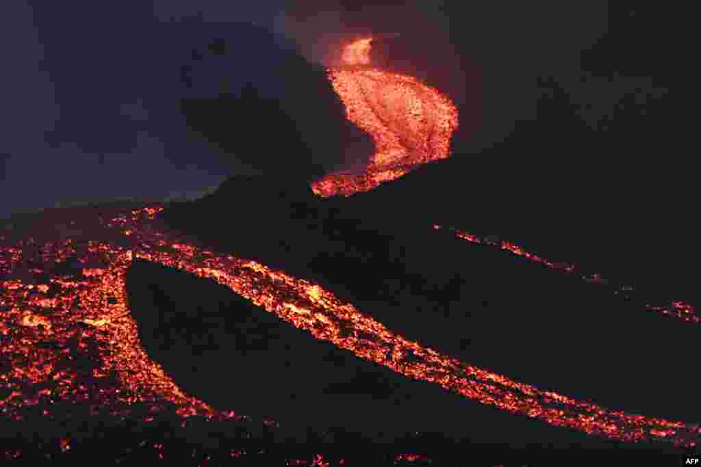 Lava flows from Guatemala's Pacaya Volcano as seen from Cerro Chino in San Vicente Pacaya municipality, south of Guatemala City, May 5, 2021.