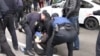Assailants attacked gay and transgender rights activists and torched a rainbow flag at a small rally in the Ukrainian city of Kharkiv.