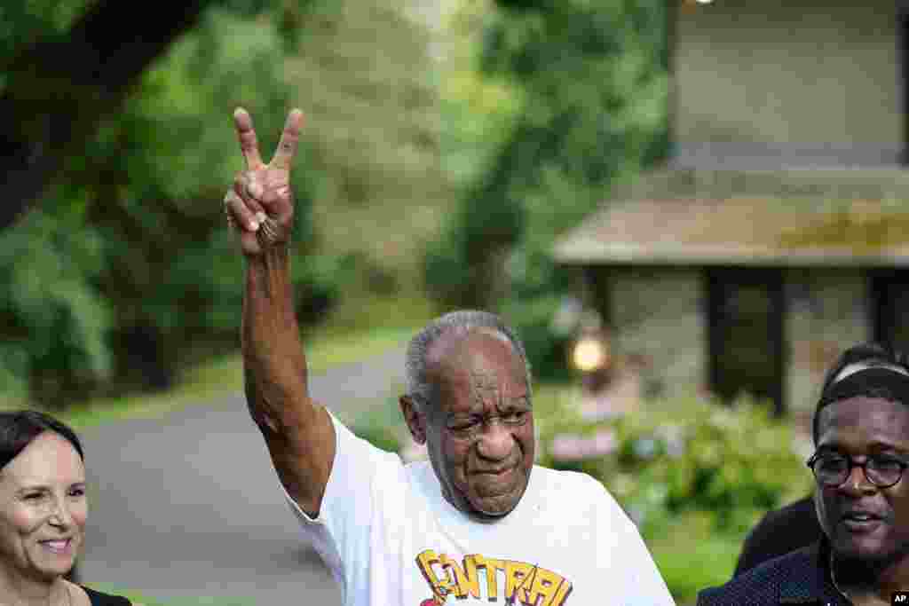 Bill Cosby gestures outside his home in Elkins Park, Pa., June 30, 2021, after being released from prison. Pennsylvania's highest court has overturned comedian Cosby's sex assault conviction.