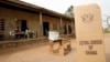 FILE - A sign for Ghana's Electoral Commission is seen at a polling station in Accra during a previous poll.