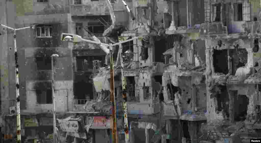 Buildings damaged by shelling in the Al-Khalidiya neighborhood of Homs, March 10, 2013.