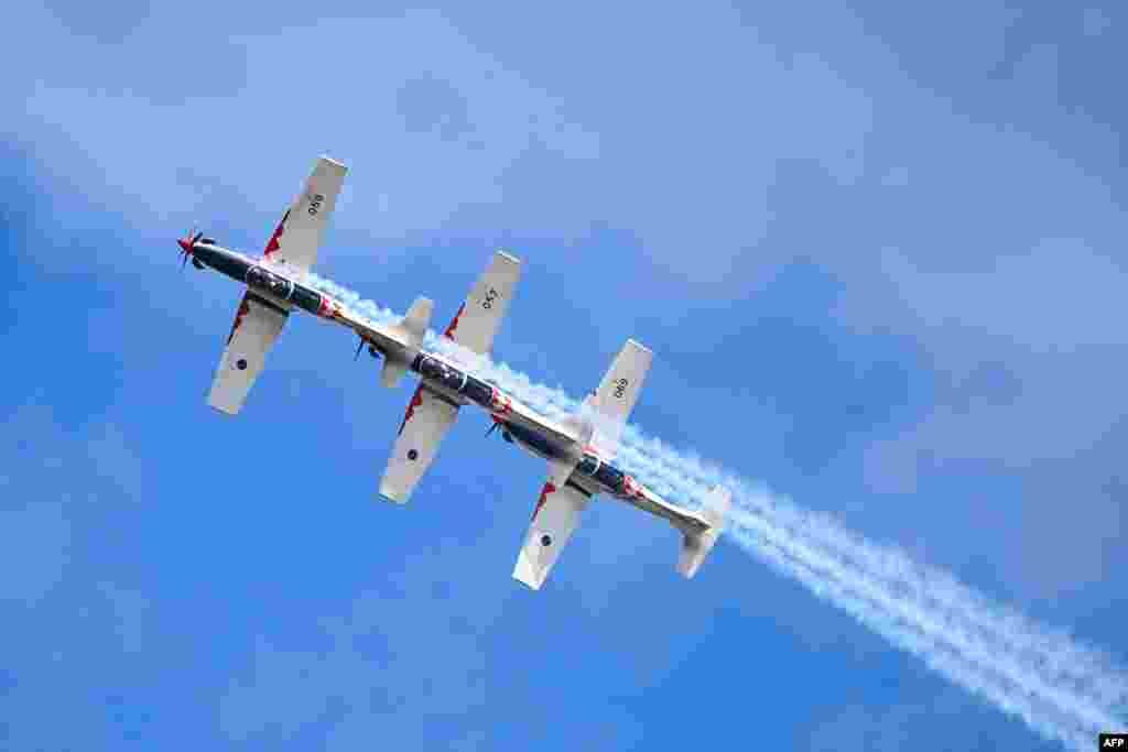 ‘Wings of Storm’ formation pilots of the Croatian Air Force perform with their PC-9M aircraft during the International Air Show at the Hungarian Air Force base in Kecskemet, southern Hungary.