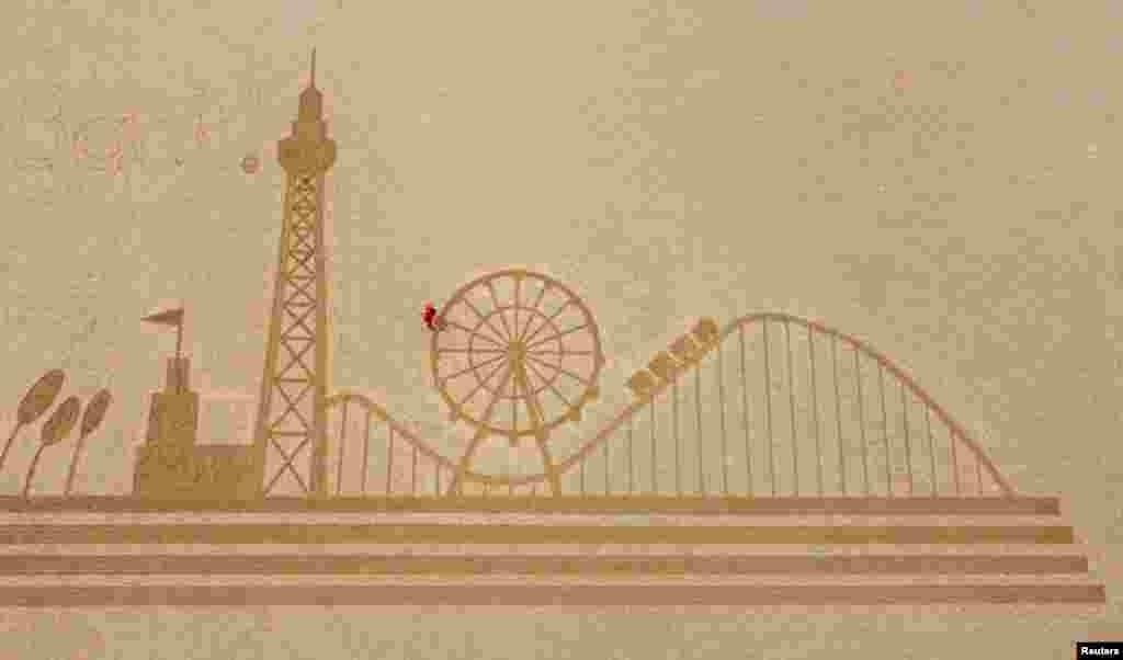 Sand In Your Eye's giant sand art is seen on Blackpool beach following the easing of coronavirus restrictions in Blackpool, Britain.