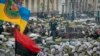 Protesters stand on a barricade in central Kiev, Feb. 1, 2014.