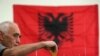 A man casts his ballot at a polling station in Tirana, June 30, 2019. 