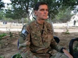FILE - Army Gen. Joseph Votel speaks to reporters during a trip to Syria, May 21, 2016.