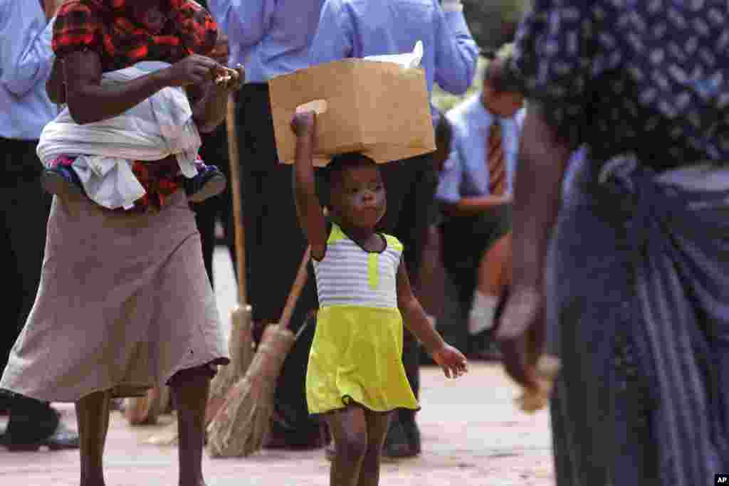 A young girl walks on the streets of Harare, Zimbabwe.