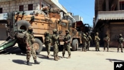 Turkish soldiers, positioned in the city center of Afrin, northwestern Syria, March 19, 2018, a day after they took the control of the area. Turkey's President Recep Tayyip Erdogan said following the victory in Syria's Afrin region, his country will expan