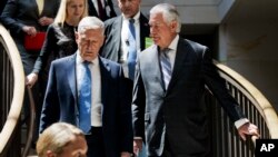 Secretary of State Rex Tillerson, right, and Defense Secretary Jim Mattis arrive on Capitol Hill in Washington, Aug. 2, 2017, to brief the Senate Foreign Relations Committee behind closed doors regarding the administration's perspective on the authorizations for the use of military force.