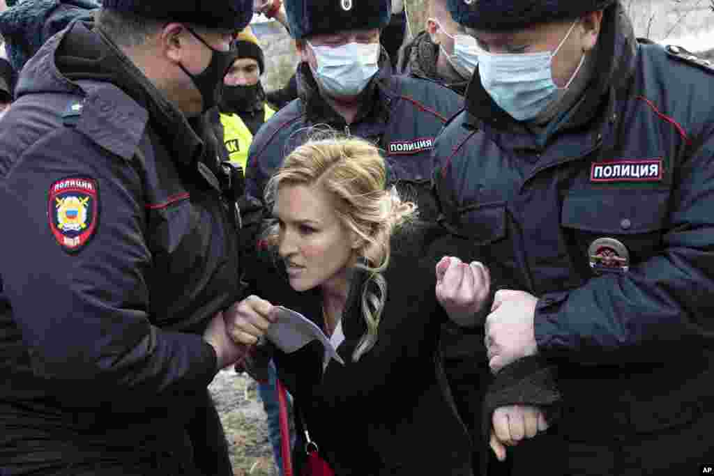 Police officers detain the Alliance of Doctors Union's leader Anastasia Vasilyeva at the prison colony IK-2 in Pokrov in the Vladimir region, east of Moscow, Russia. Doctors from the Navalny-backed union demand the opposition leader gets qualified medical help from independent doctors.