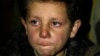  A young boy waits to be evacuated from the besieged town of Madaya, northwest of Damascus, Syria, on Jan. 11, 2016.