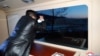 This picture taken on Jan. 11, 2022, and released from North Korea's official Korean Central News Agency on Jan. 12, 2022, shows North Korean leader Kim Jong Un observing what state media says is a hypersonic missile test-fire at an undisclosed location in North Korea. 