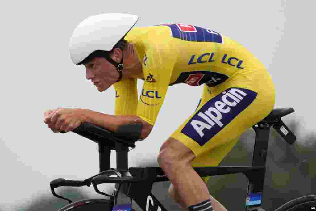 Netherland's Mathieu Van Der Poel, wearing the overall leader's yellow jersey, competes during the fifth stage of the Tour de France cycling race, an individual time-trial over 27.2 kilometers (16.9 miles) with start in Change and finish in Laval Espace Mayenne, France.